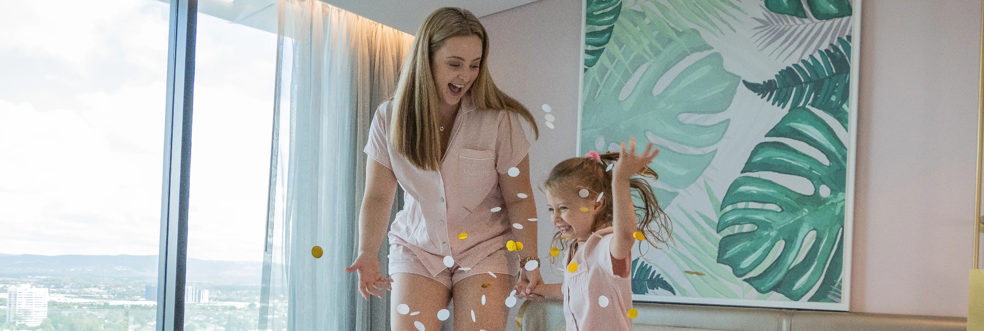 Joyful mother and daughter playing together.